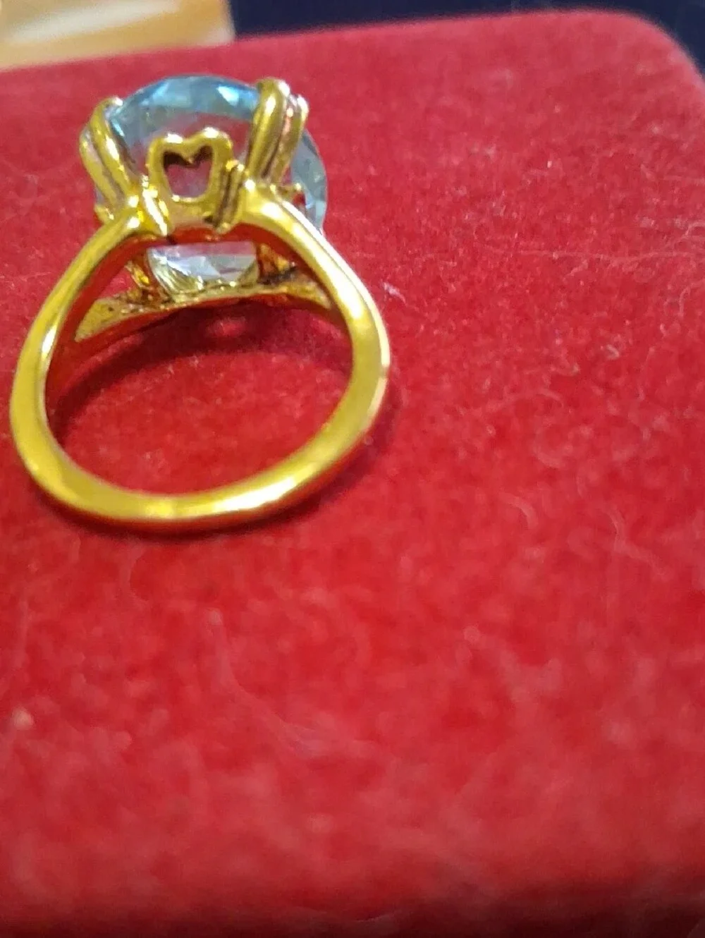 Source Unknown Gold Ring with Light Blue Round Stone